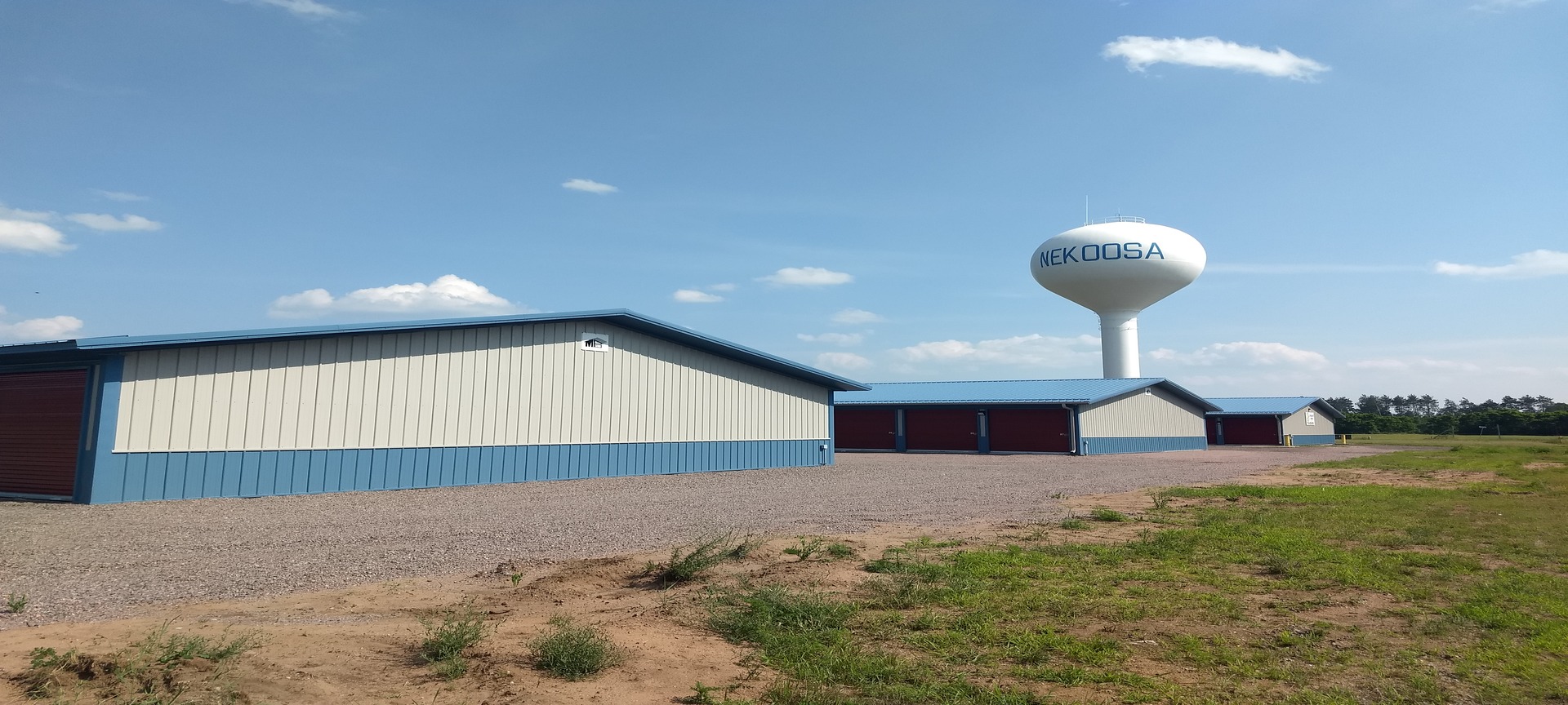 Stuff it Storage buildings in Nekoosa with the Nekoosa water tower behind them